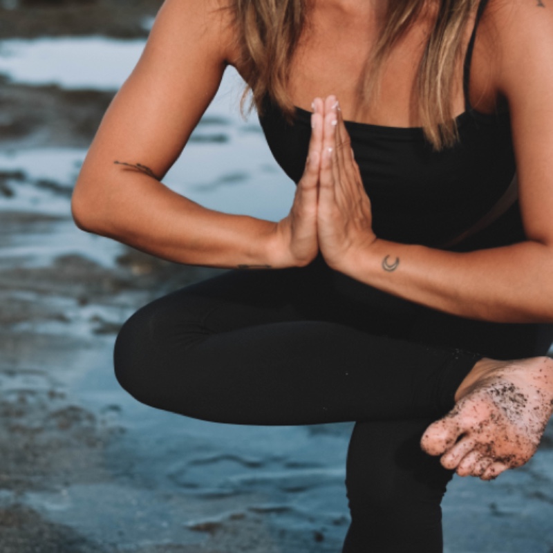 yoga pose by the sea